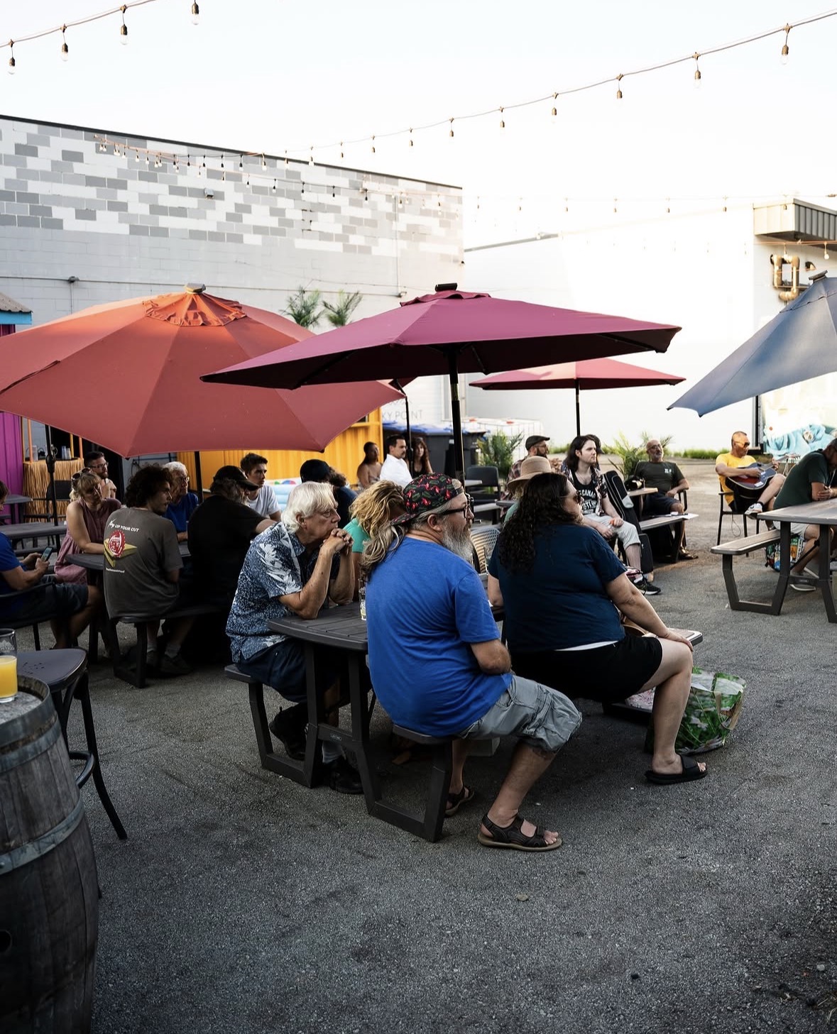 Guests watching open mic on the patio